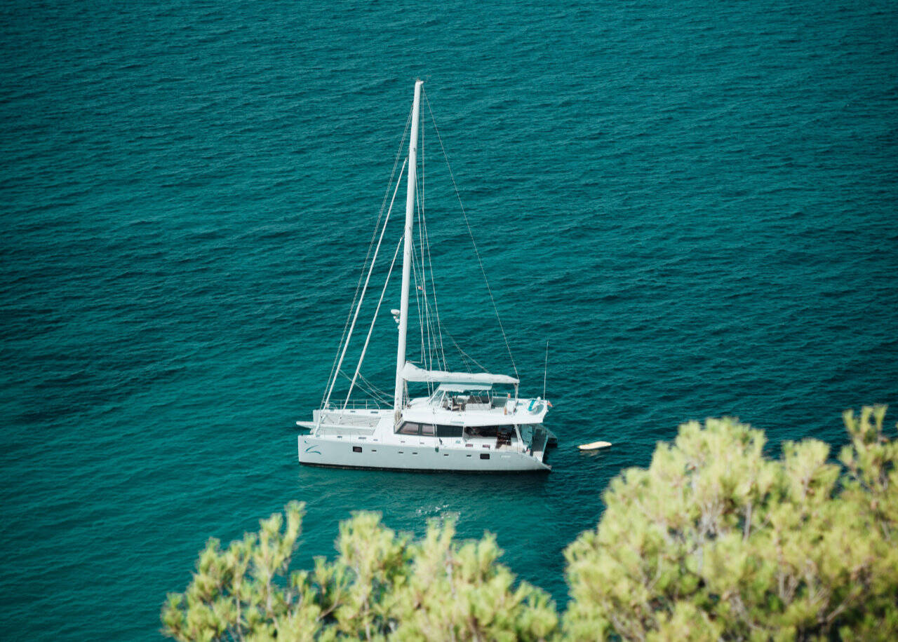 Catamaran anchored in Es Vedera, Ibiz, Spain