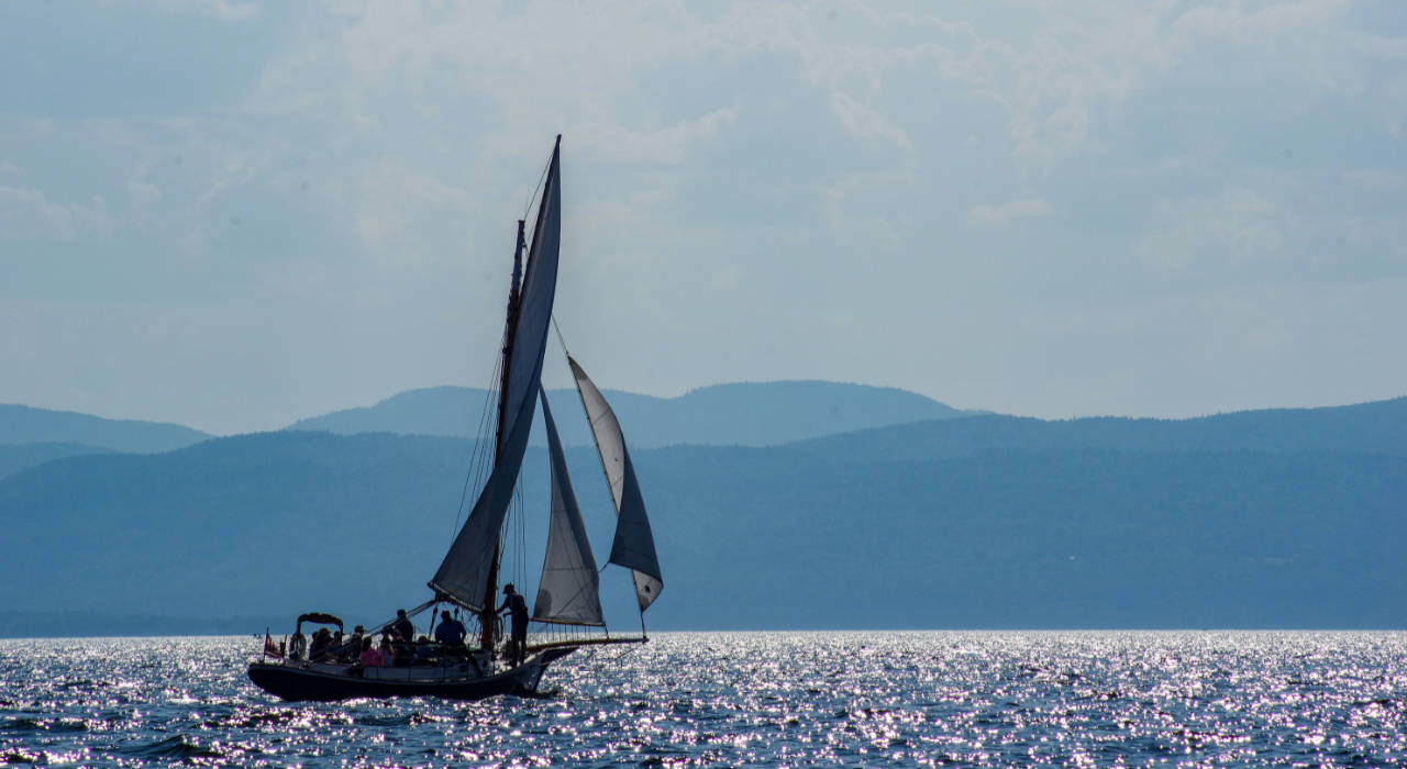 Sailboat on the sparkling waters of Lake Champlain in Vermont.